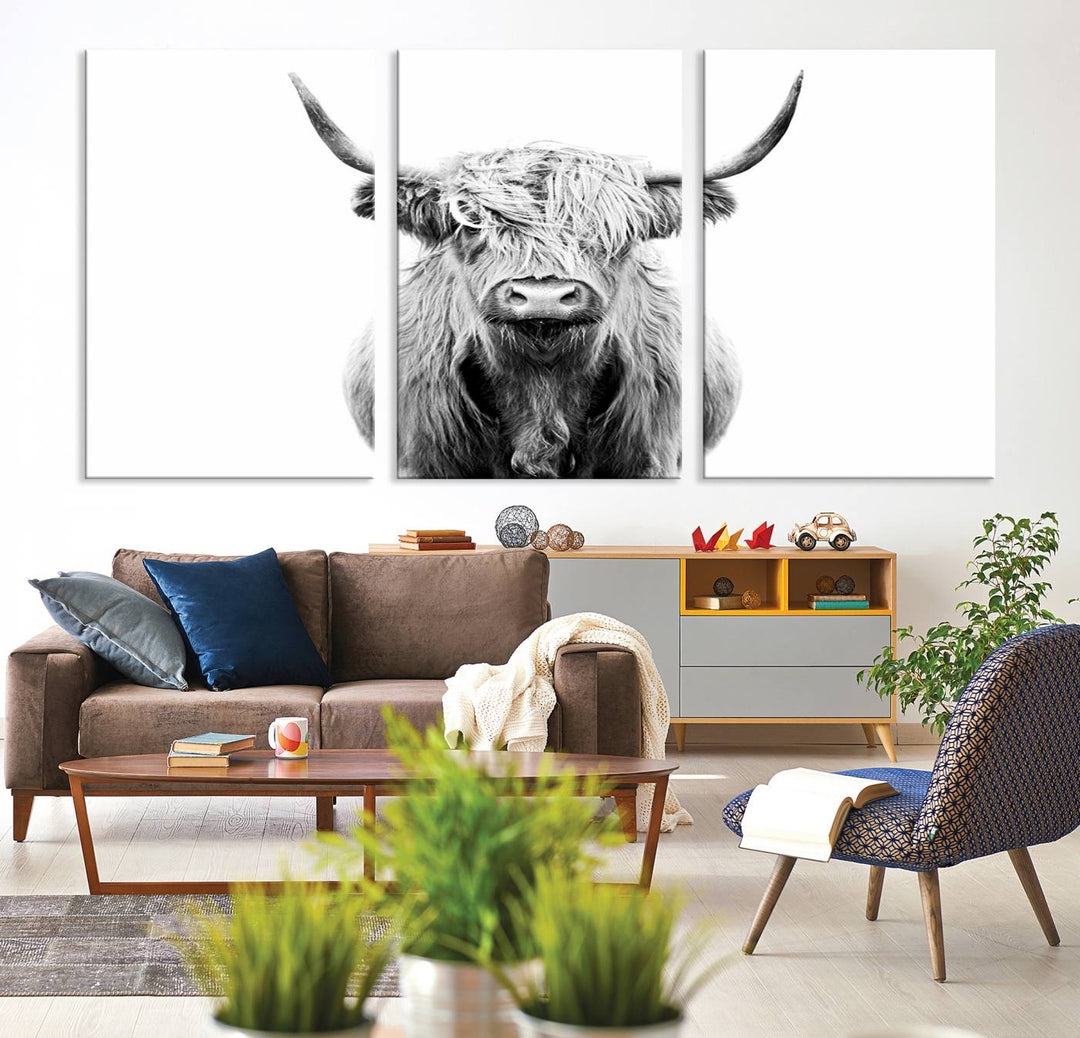 The wall art features a triptych of a Scottish Highland cow, printed on museum-quality canvases with a UV-protective coating. This decorative piece is known as the Highland Cow Canvas Wall Art Farm House Wall Art.