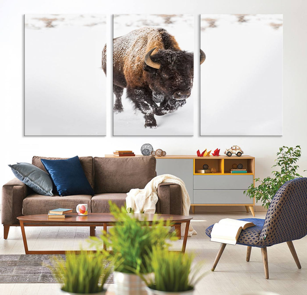 The Bison Winter Wall Art Canvas Print for Farmhouse Decor is displayed as a triptych in the living room. This artwork, printed on museum-quality canvases with a UV-protective coating to maintain its vibrant colors, is the focal point of the space.