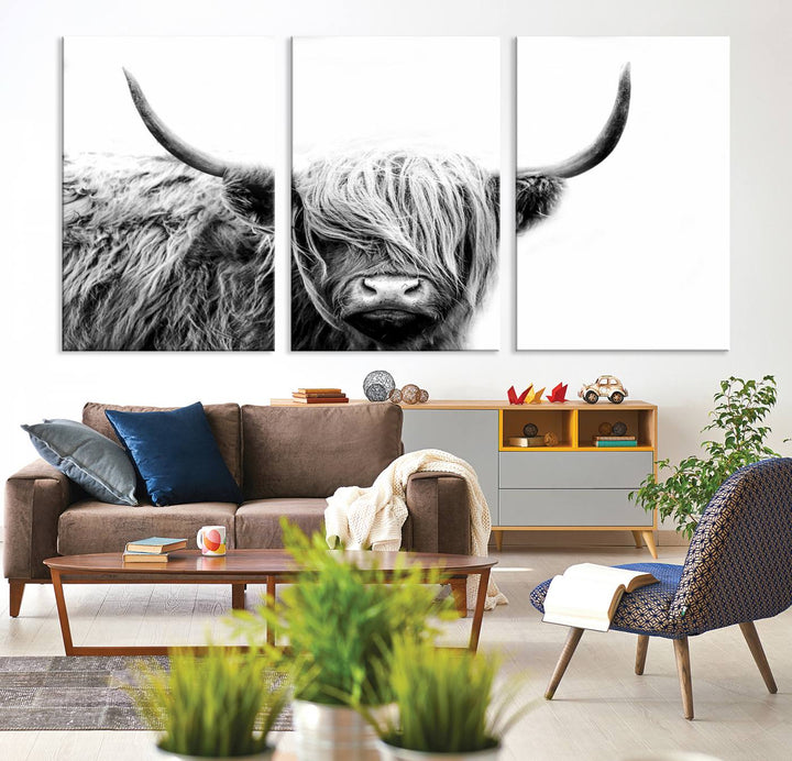 A museum-quality triptych titled "Black White Scottish Highland Cow Cattle Art Print Farmhouse Wall Art Canvas Print" embellishes the dark wall. The canvas is equipped with a UV-protective coating to ensure lasting vibrancy.