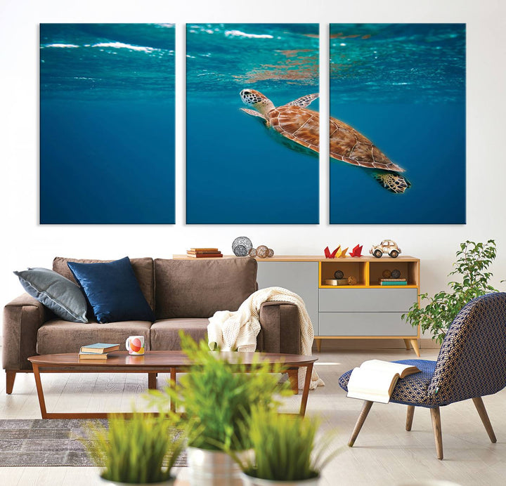 The living room features the "Baby Turtle in Ocean" wall art canvas print. This gallery-quality piece, depicting a sea turtle swimming underwater, adds an elegant touch to the space.