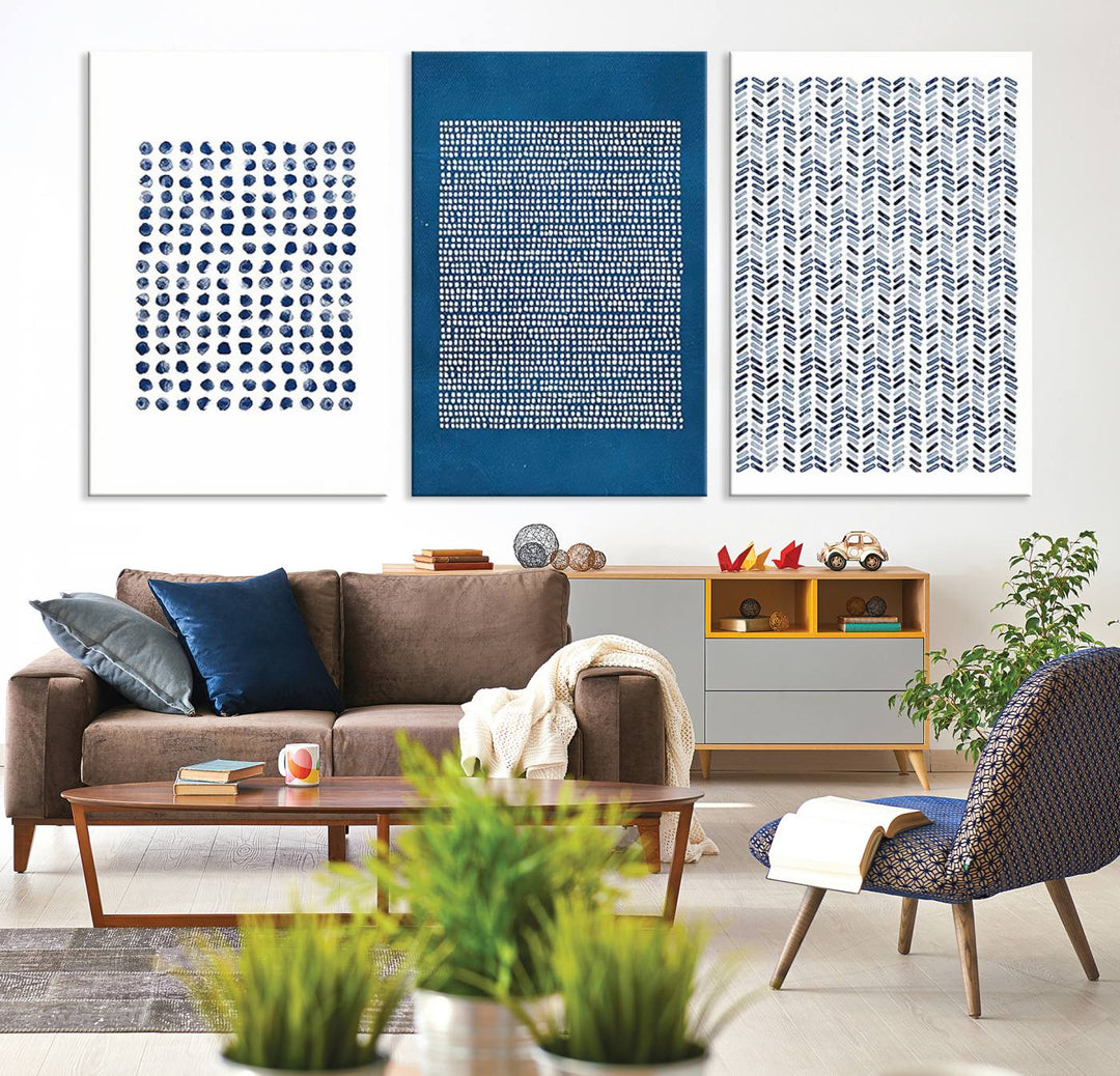 The modern living room is beautifully complemented by the "Canvas Print Wall Art Set Navy Blue White Geometric Dot Collage Abstract Illustr Art" on the wall. This art is printed on museum-quality canvas with a UV-protective coating for enhanced durability and vibrancy. Each piece is ready to hang, offering an effortless upgrade to your space.