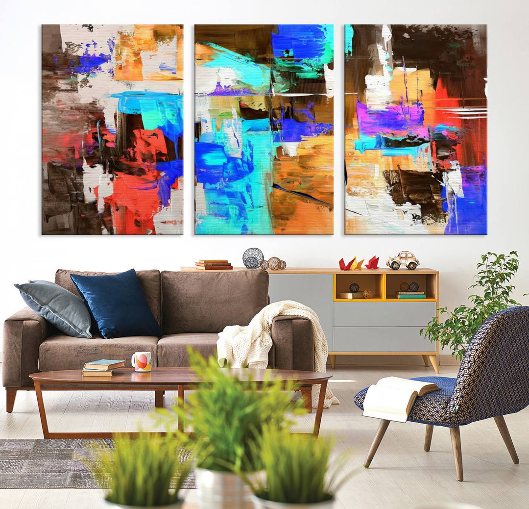 In a modern living room, the "Colorful Abstract Wall Art Canvas Print" serves as a stunning triptych centerpiece on museum-quality canvas, ready to hang. Its UV-protective coating ensures enduring vibrancy.