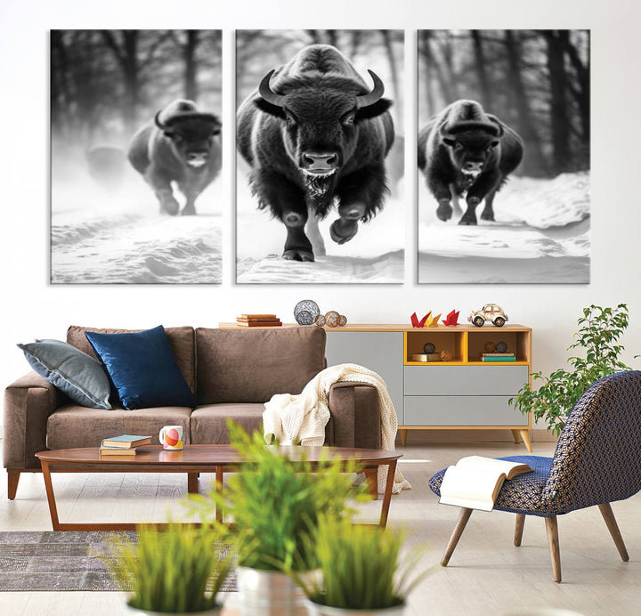 Transform your living room with the Buffalo Wall Art Canvas Print triptych, showcasing a bison family in motion across a snowy landscape. This striking Western decor piece becomes the focal point of any room.