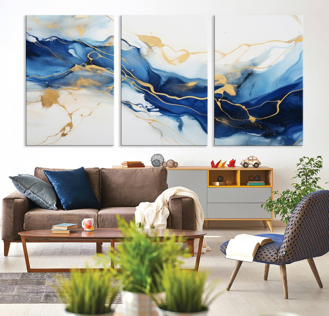 The Blue Abstract Wall Art is displayed as a triptych on museum-quality canvas, showcasing a blue and gold abstract design. The artwork includes a UV-protective coating to maintain its vibrancy and comes with the benefit of free shipping.