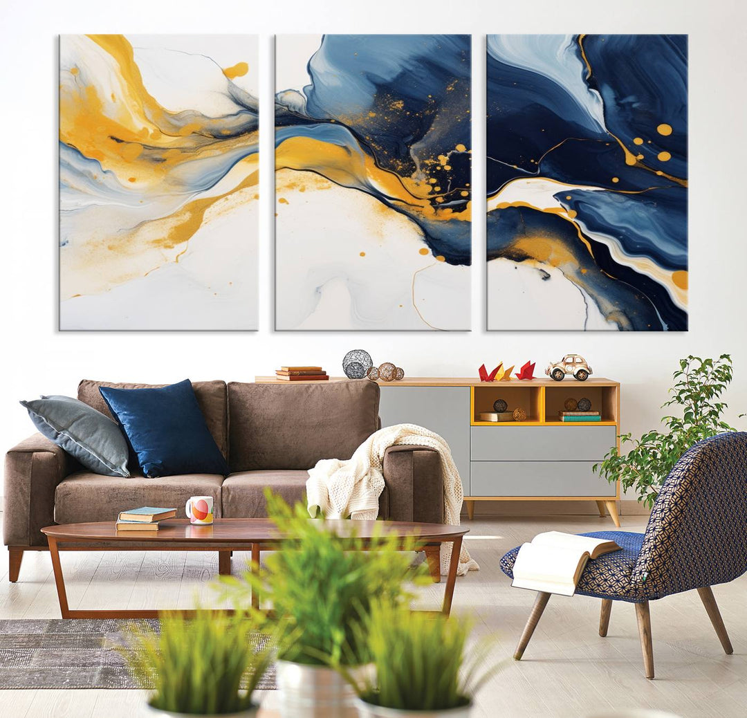 The Blue and Gold Abstract Fluid Canvas Art, with its swirling patterns, adorns the wall. This modern wall art beautifully complements the contemporary interior decor, adding an elegant touch with its rich blue, gold, and white tones.