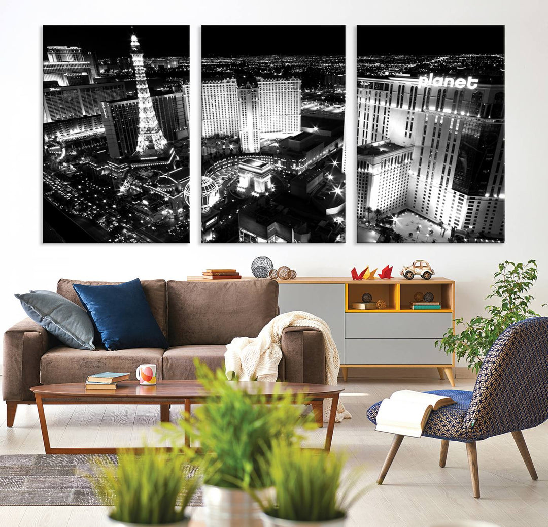 The Las Vegas Wall Art Canvas Print is a black and white triptych that showcases a city skyline at night. Crafted on museum-quality canvas with a UV-protective coating, it serves as an elegant and ready-to-hang focal point in the room.