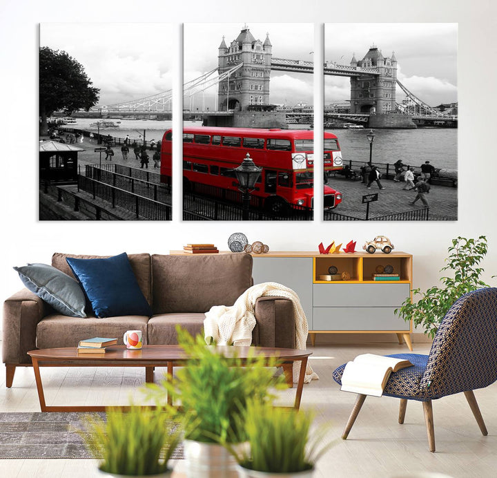 The London Red Bus and Bridge Wall Art Canvas Print showcases a red London bus in front of Tower Bridge, beautifully presented as a gallery-wrapped canvas. This striking image is divided into three panels, delivering a museum-quality display that's ready to hang.