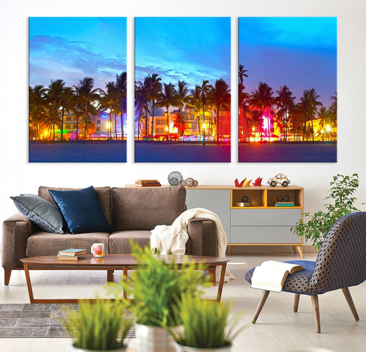 The living room features a three-panel Miami City Wall Art Canvas Print, showcasing a colorful, illuminated beach scene with palm trees on museum-quality canvas.