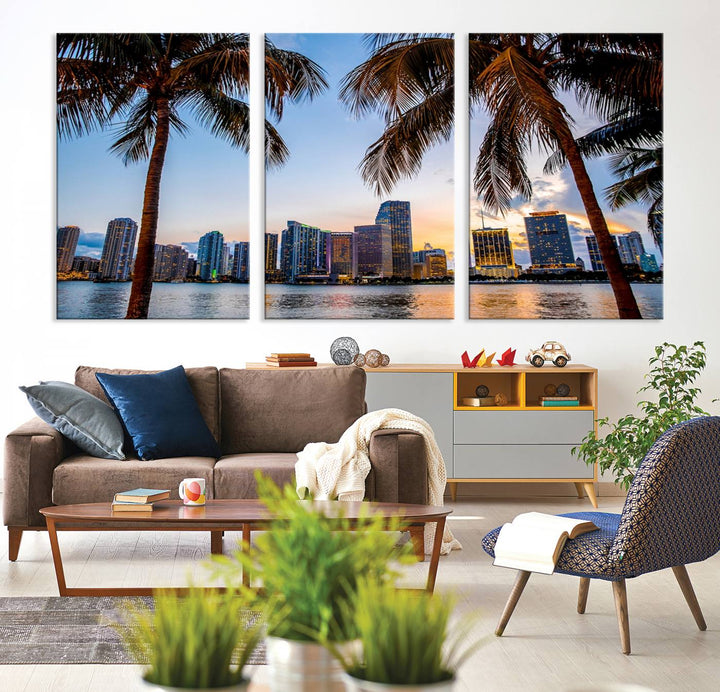 The Wall Art MIAMI Canvas Print features a triptych design depicting palm trees and a city skyline at sunset.