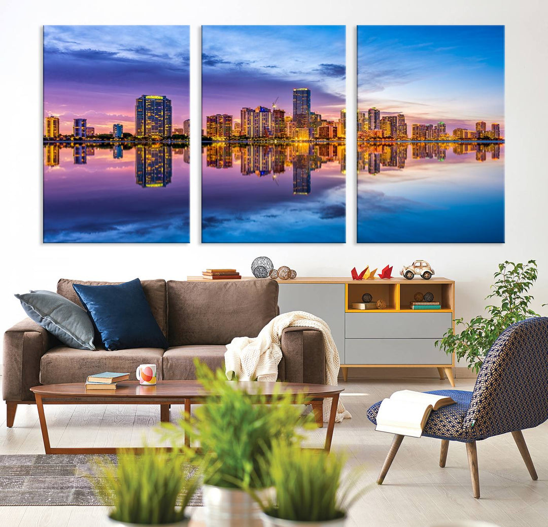 The Miami City Wall Art Canvas Print, featuring a three-panel depiction of a city skyline at sunset reflected in water, beautifully enhances the wall. Made with museum-quality canvas and a UV-protective coating, it comes ready to hang.