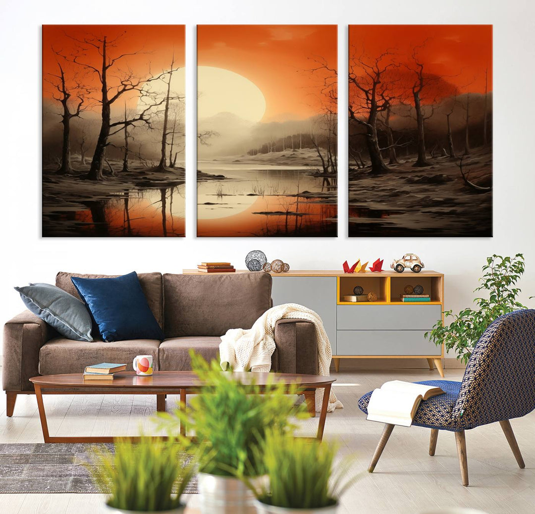 The "Abstract Watercolor Trees and Sunset on Lake Wall Art" is a triptych masterpiece, showcasing an orange-hued landscape of barren trees and a large sun. Displayed on museum-quality canvases with UV-protective coating, it creates a striking visual element in any space.