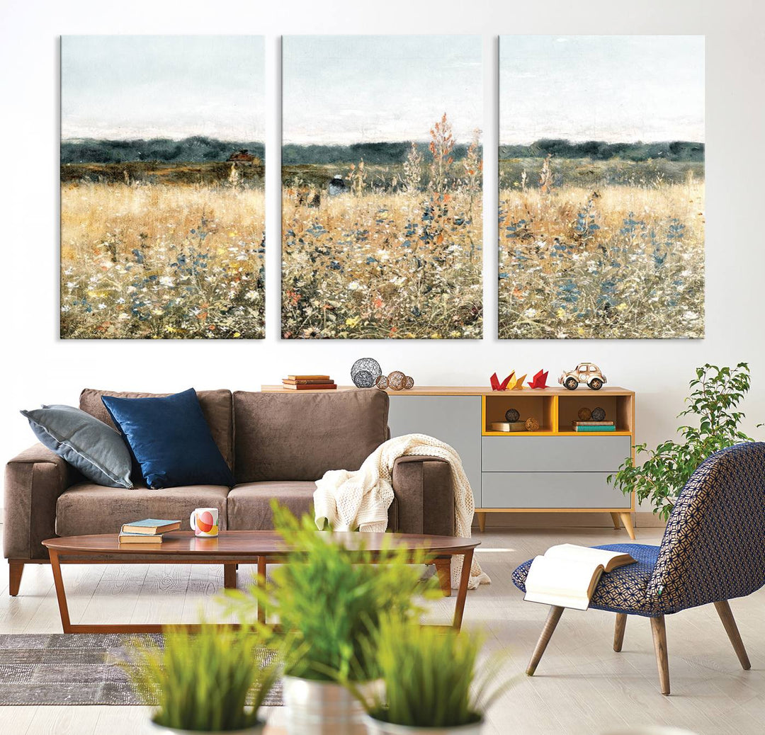 The "Wildflower Field Wall Art Canvas" brings rustic charm to the room with its nature-inspired landscape print, making it a perfect addition to the living room or office.