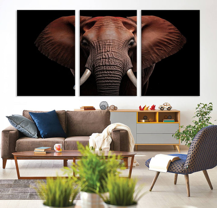 A stunning triptych titled "Wild Elephant Wall Art Canvas Print" beautifully enhances the wall above a contemporary living room. This Africa Savannah Wild Animal Wall Decor Print is of museum-quality, complete with a UV-protective coating to ensure its vibrancy and beauty are preserved for years.