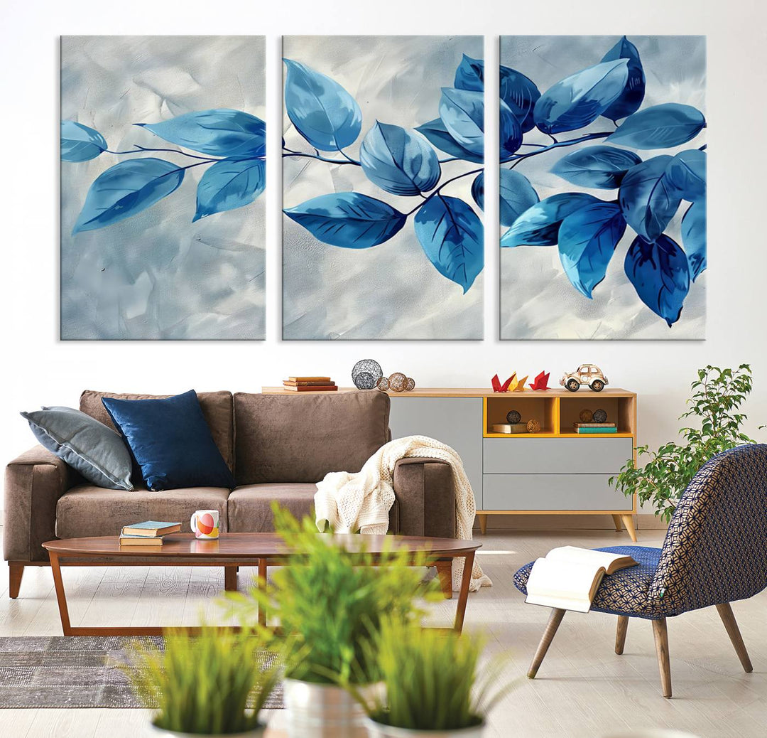 A Blue Leaf Abstract Wall Art Canvas Print, featuring a textured background and gallery-quality finish, is displayed.