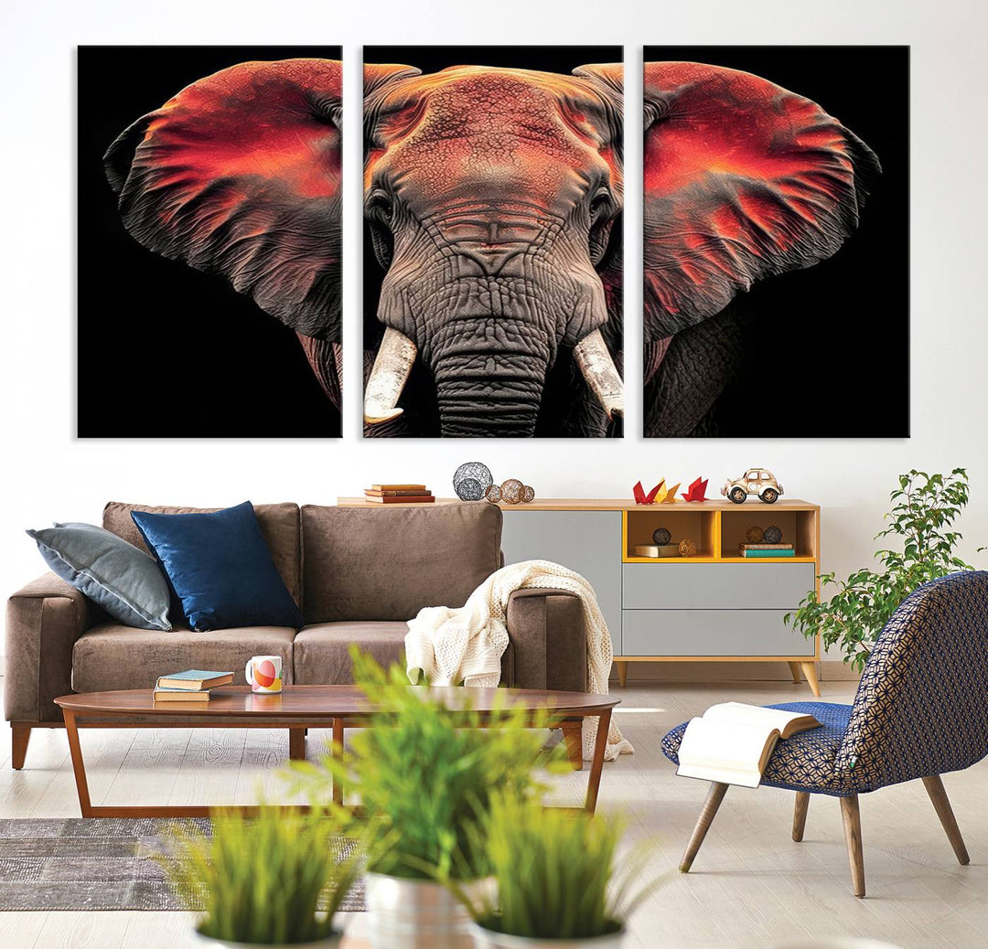 The Elephant Wall Art Canvas Print, featuring vibrant red and black tones, is a stunning artwork printed on museum-quality canvas. It comes with a UV-protective coating.