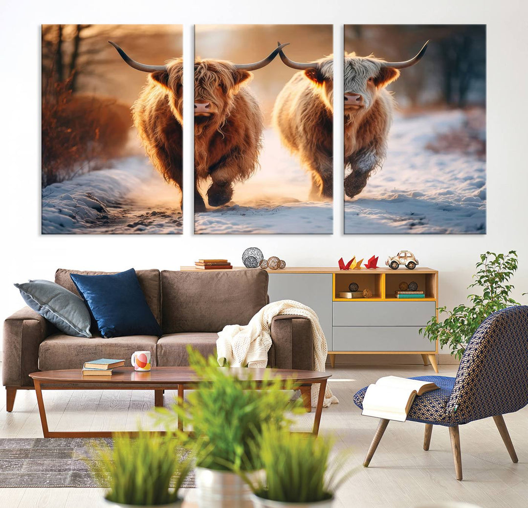 The living room showcases a triptych from the Scottish Highland Cow Horn Farm Wall Art Canvas Print collection, depicting two Highland cows running in the snow. Complementing this are handmade wall art pieces with a gallery-quality finish that add an elegant touch.