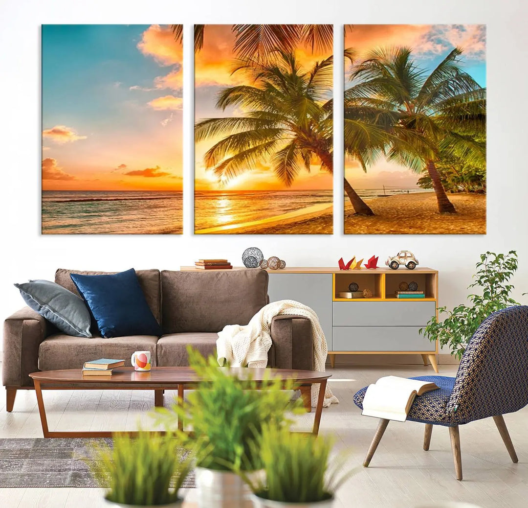 The Tropical Sunset Wall Art Print features a vibrant beach scene with palm trees and an ocean view highlighted by a golden sunset.