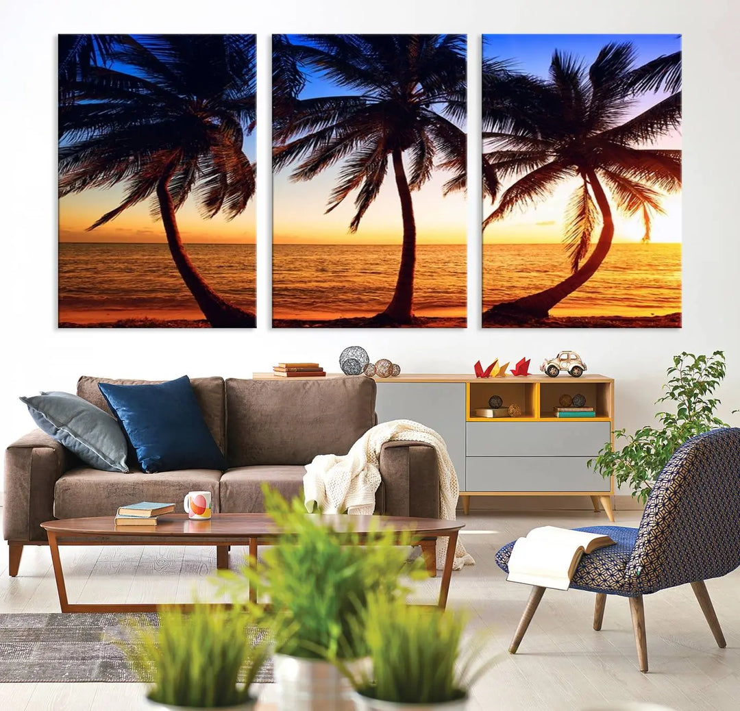 The living room features a wall adorned with the "Wall Art Canvas Curve Palms at Sunset on Beach," showcasing gallery-wrapped, museum-quality canvases in a stunning triptych.