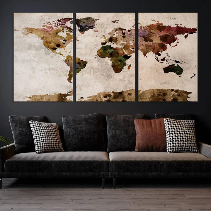 A Watercolor World Map Canvas Print, wrapped in an elegant gallery style, hangs on the wall.