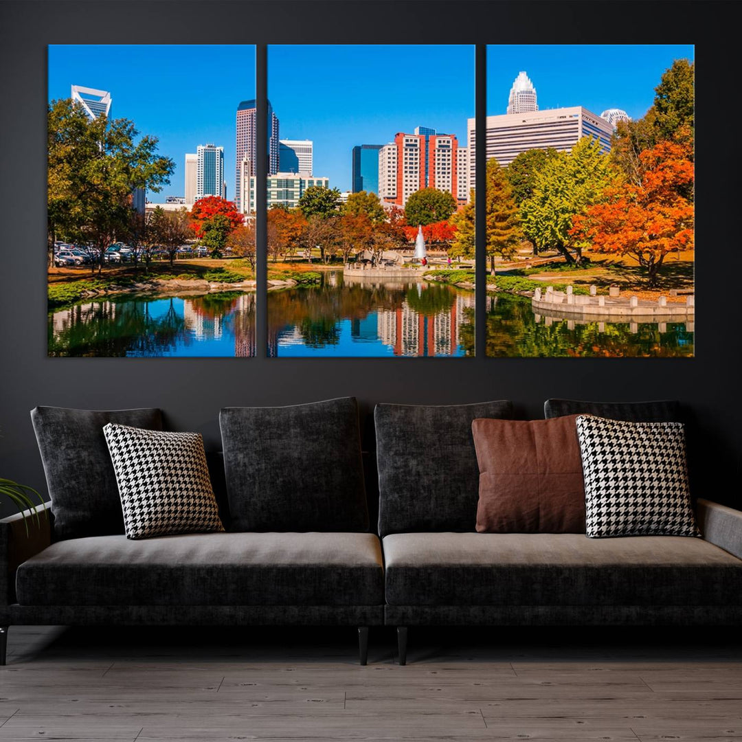 The Charlotte City Park at Fall Skyline Cityscape View wall art canvas print features a city panorama with a park and lake accented by autumn trees. It is mounted on museum-quality canvas with UV-protective coating and decorates the space.