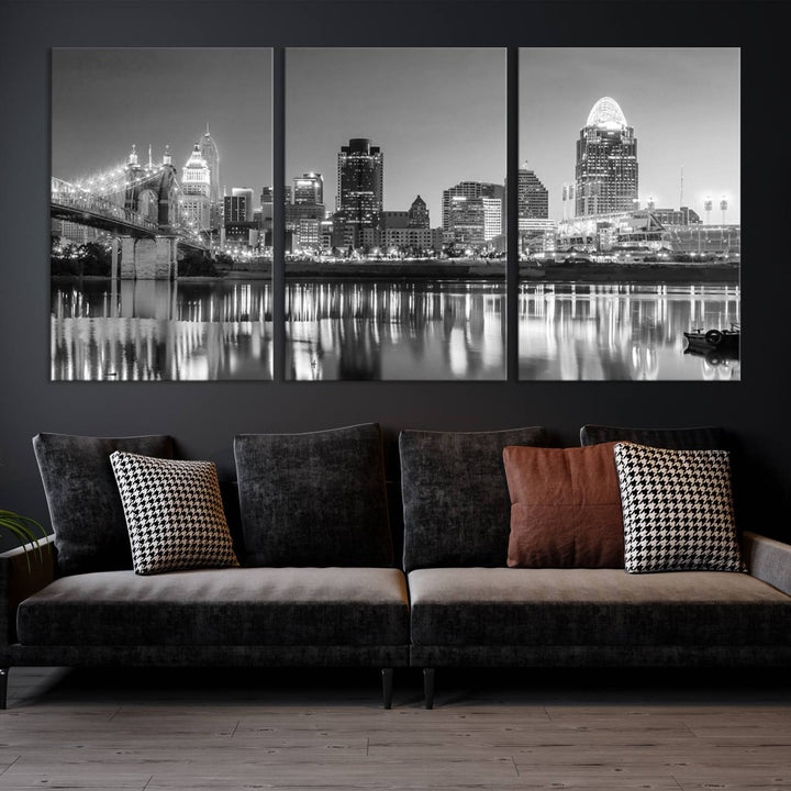 The "Cincinnati City Lights Skyline Black and White Wall Art Cityscape Canvas Print" is elegantly displayed in a stylish living room.