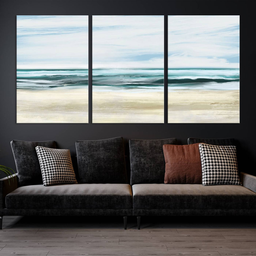 The room features the Ocean Abstract Wall Art Canvas Print, a triptych beach painting on museum-quality canvas with a gallery-wrapped finish and UV-protective coating.