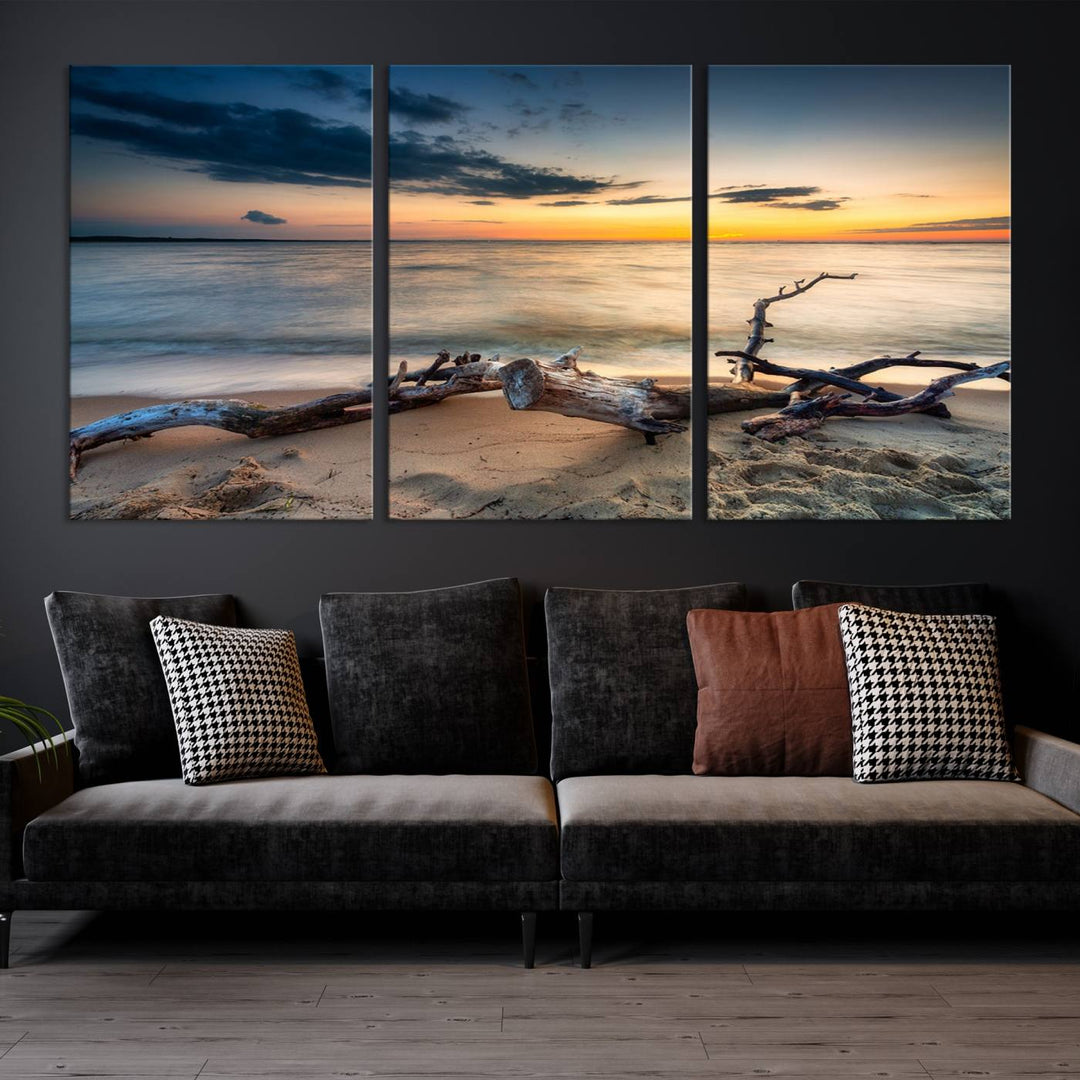 A captivating piece of Ocean Sunset Beach Wall Art Canvas Print, gallery wrapped, graces the gray wall.