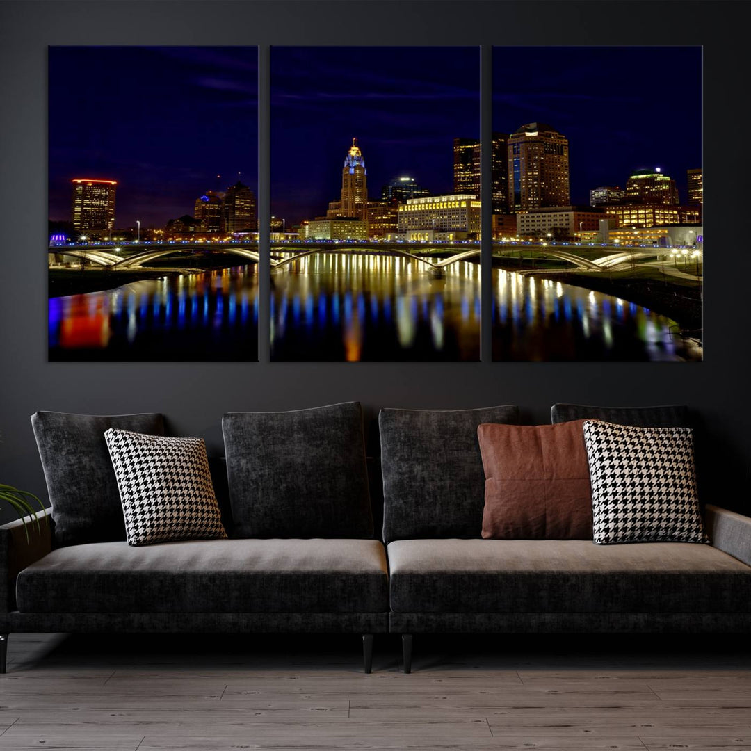 The "Columbus City Lights Night Skyline Cityscape View Wall Art Canvas Print" showcases a stunning city skyline at night, with illuminated buildings and bridges reflecting in the river, on a museum-quality canvas ready to hang.