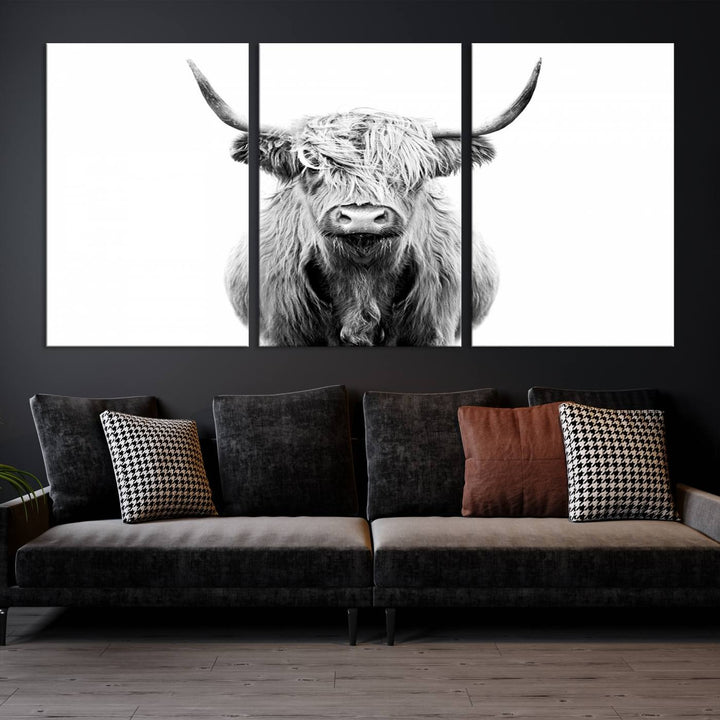 The wall art features a triptych of a Scottish Highland cow, printed on museum-quality canvases with a UV-protective coating. This decorative piece is known as the Highland Cow Canvas Wall Art Farm House Wall Art.