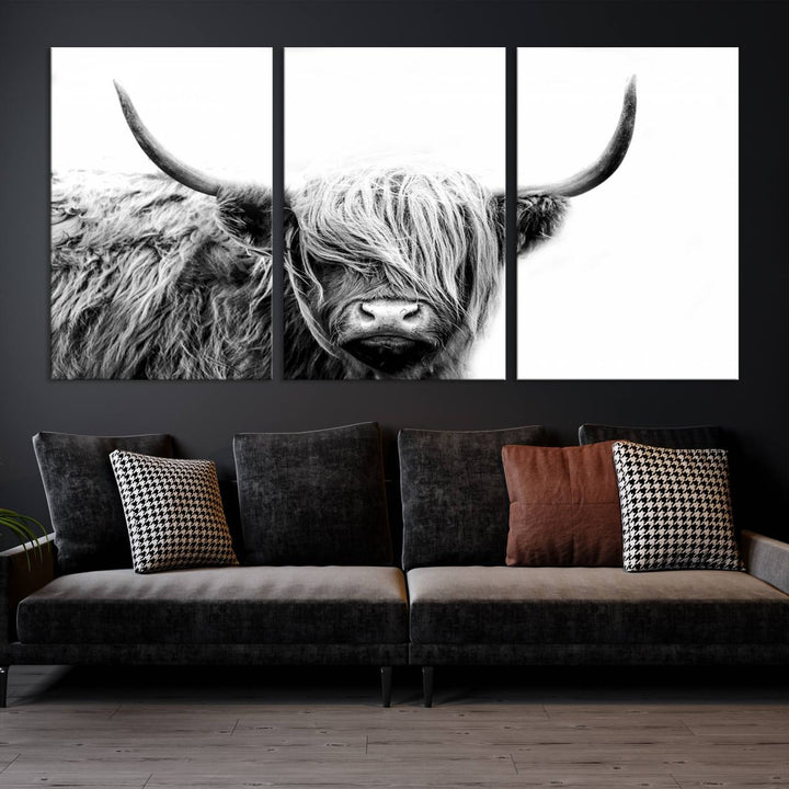 A museum-quality triptych titled "Black White Scottish Highland Cow Cattle Art Print Farmhouse Wall Art Canvas Print" embellishes the dark wall. The canvas is equipped with a UV-protective coating to ensure lasting vibrancy.