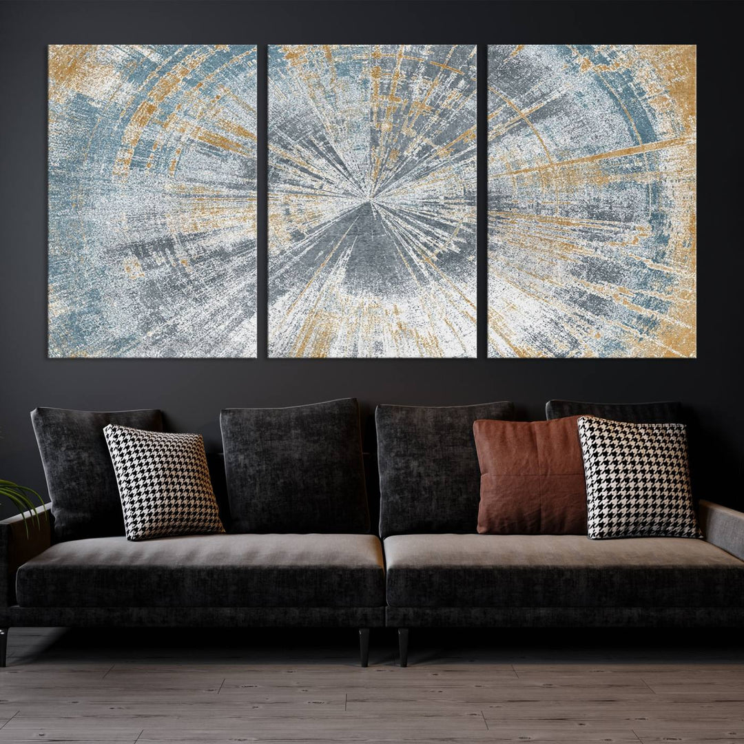 The Radiant Abstract Wood Rings Canvas Art, a modern triptych wall decor, enhances the contemporary style of the living room with its blue, white, and gold hues.