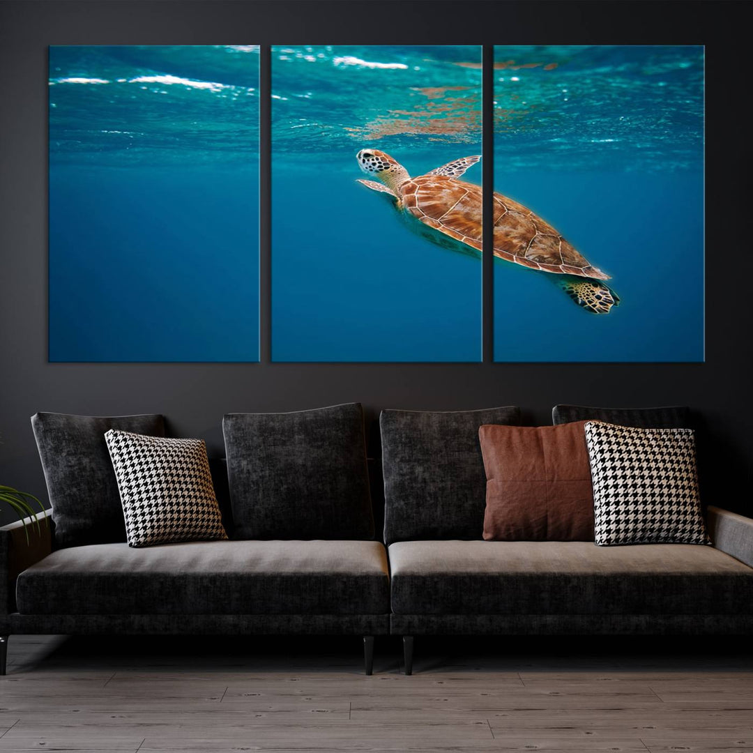 The living room features the "Baby Turtle in Ocean" wall art canvas print. This gallery-quality piece, depicting a sea turtle swimming underwater, adds an elegant touch to the space.