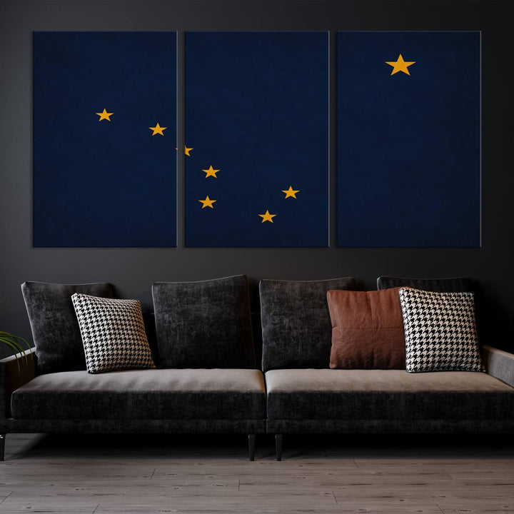 A contemporary living room featuring a triptych artwork of stars on a navy background, accentuated by the striking Alaska States Flag Wall Art Canvas Print.