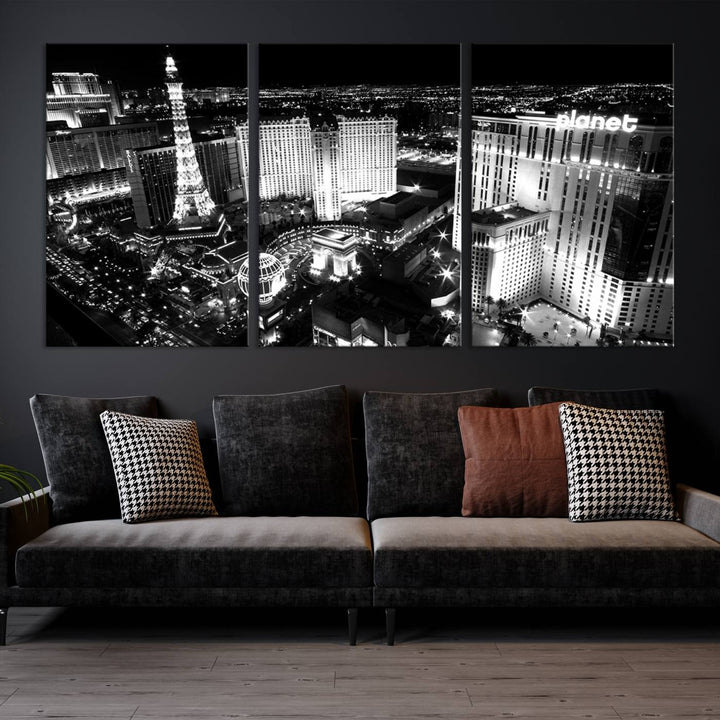 The Las Vegas Wall Art Canvas Print is a black and white triptych that showcases a city skyline at night. Crafted on museum-quality canvas with a UV-protective coating, it serves as an elegant and ready-to-hang focal point in the room.