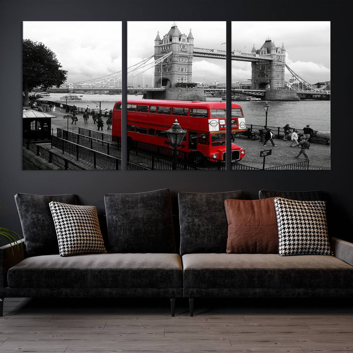 The London Red Bus and Bridge Wall Art Canvas Print showcases a red London bus in front of Tower Bridge, beautifully presented as a gallery-wrapped canvas. This striking image is divided into three panels, delivering a museum-quality display that's ready to hang.