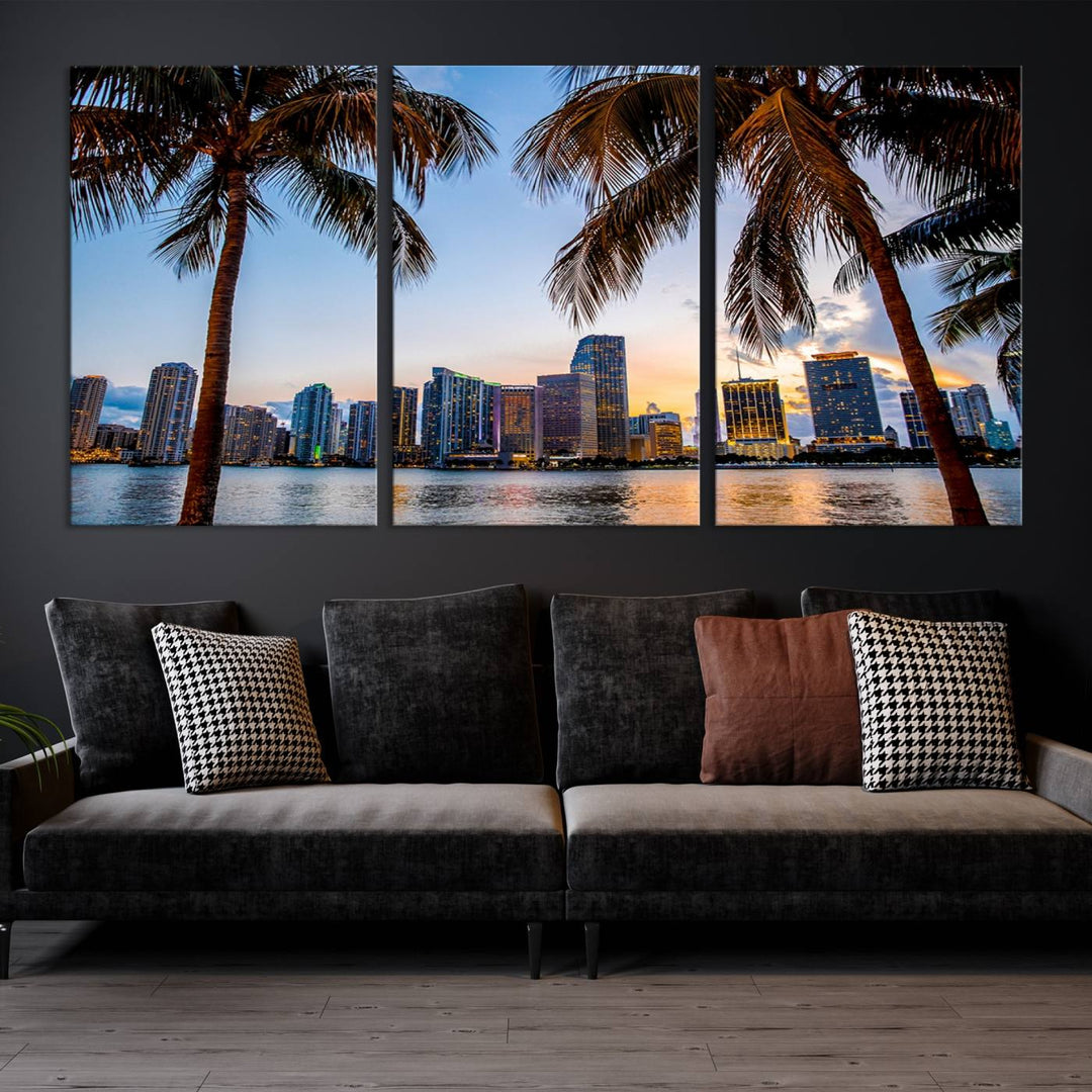 The Wall Art MIAMI Canvas Print features a triptych design depicting palm trees and a city skyline at sunset.