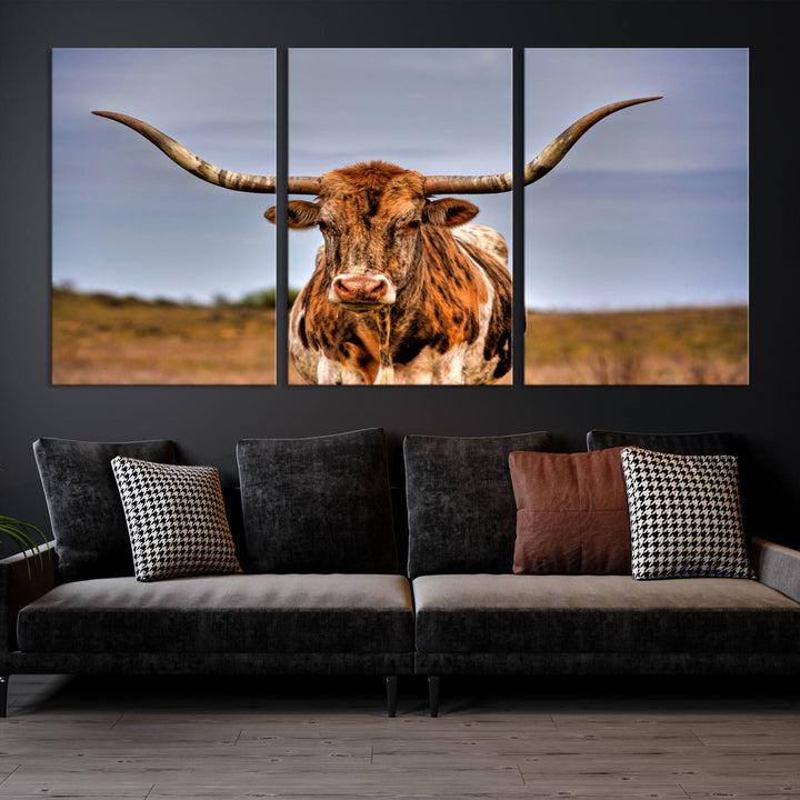 The Texas Longhorn Wall Art Print, a triptych canvas artwork depicting a longhorn bull in a field, features a gallery-quality finish.