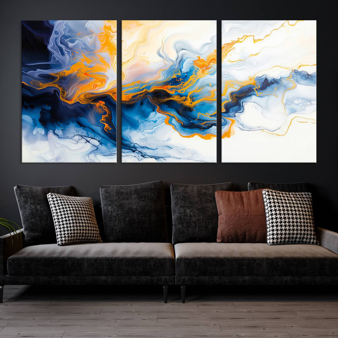 A stunning Fluid Alcohol Ink Wall Art with Gold Wall Art Canvas Print, featuring vibrant blue, orange, and white swirls, adorns the wall. This gallery-quality finish adds an exquisite touch to any living space.