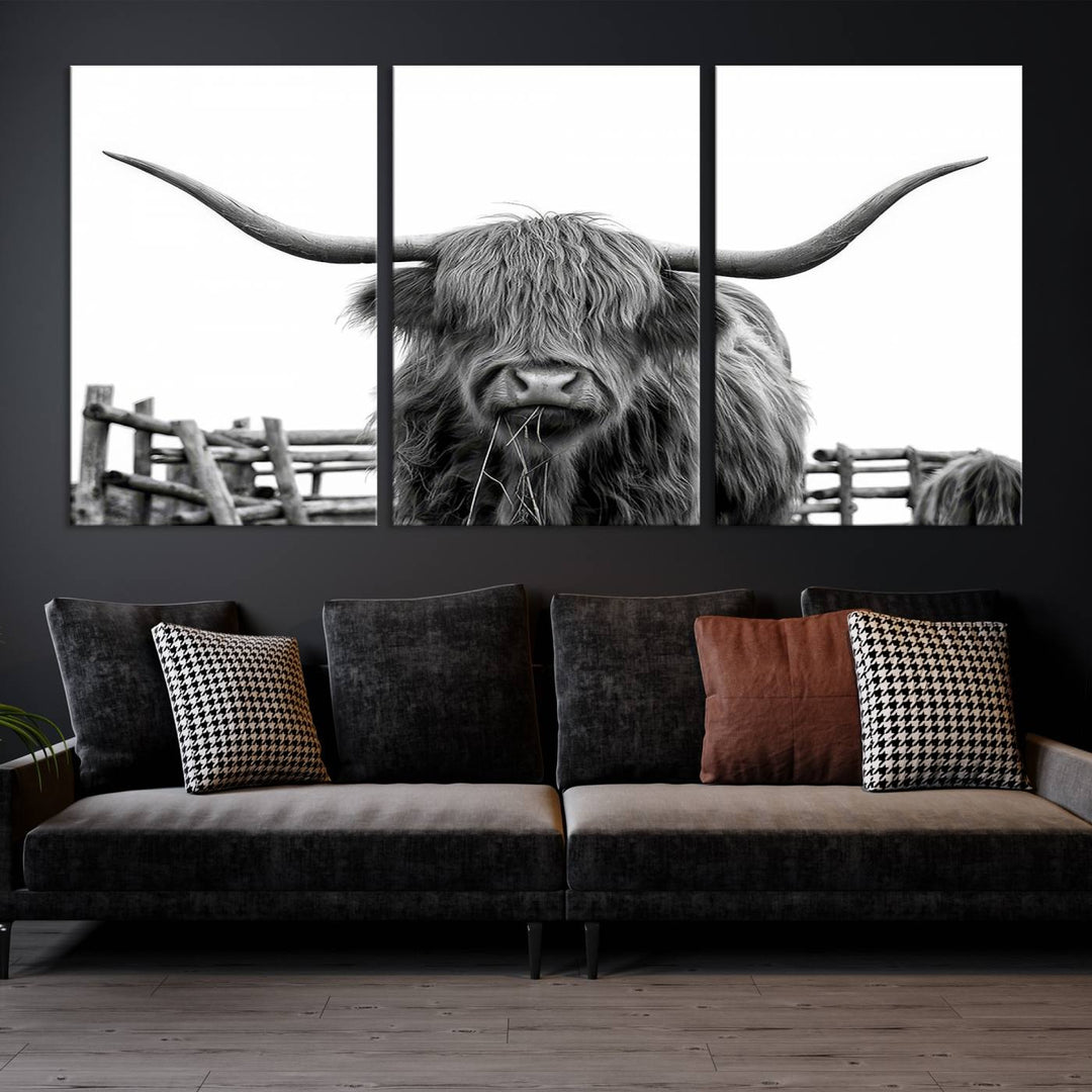 The Longhorn Canvas Print, featuring a black-and-white triptych of a Bighorn cow with shaggy fur and impressive long horns, is elegantly showcased. This wall art piece boasts a gallery-quality finish on premium canvas, bringing sophistication to any room.