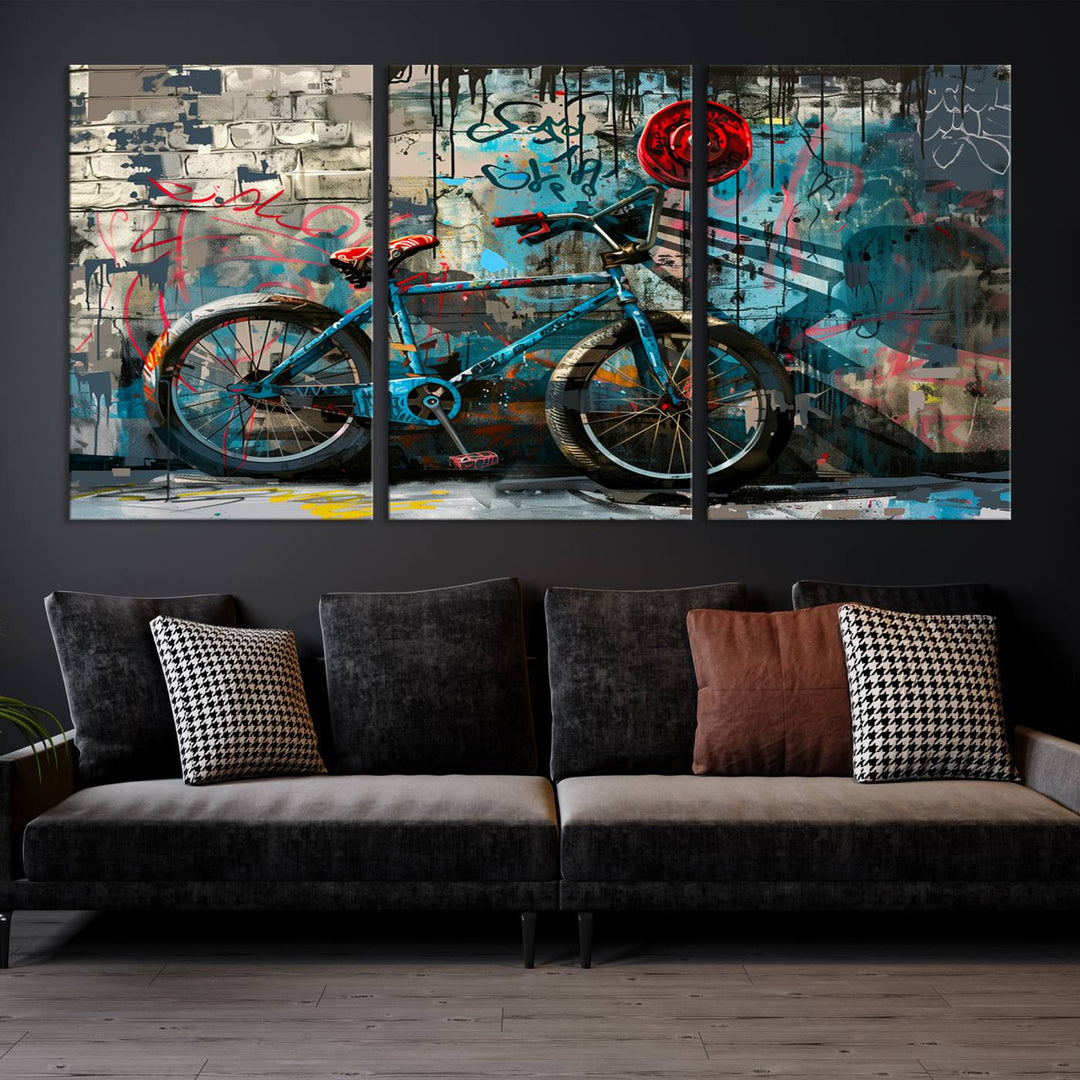 A modern living room features a triptych wall art of an abstract bicycle, designed in a graffiti style on a brick wall. This piece is expertly crafted on the Abstract Bicycle Wall Art Canvas Print, offering a premium canvas that ensures a gallery-quality finish.