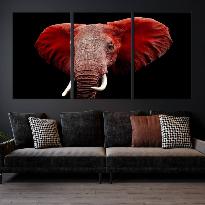 A Wall Art Canvas Print in the modern living room features a three-panel premium design of a red elephant face.