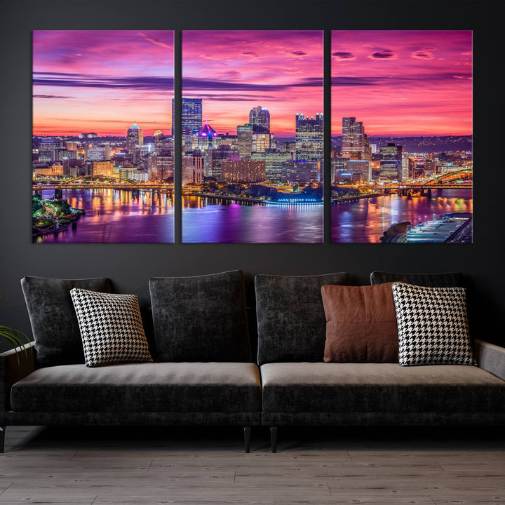 The Pittsburg Wall Art Canvas Print, showcasing a vibrant sunset glow over the city skyline and crafted by a professional artisan, adorns the space.