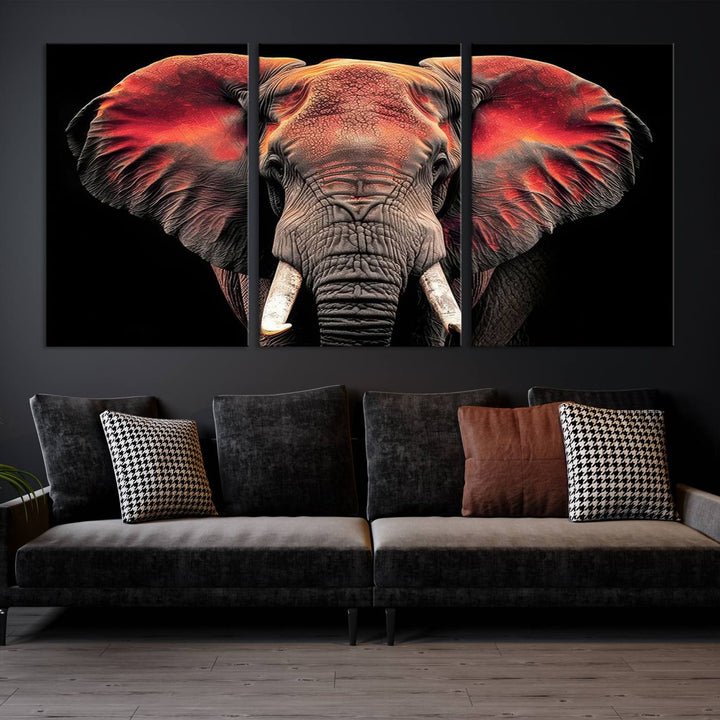 The Elephant Wall Art Canvas Print, featuring vibrant red and black tones, is a stunning artwork printed on museum-quality canvas. It comes with a UV-protective coating.