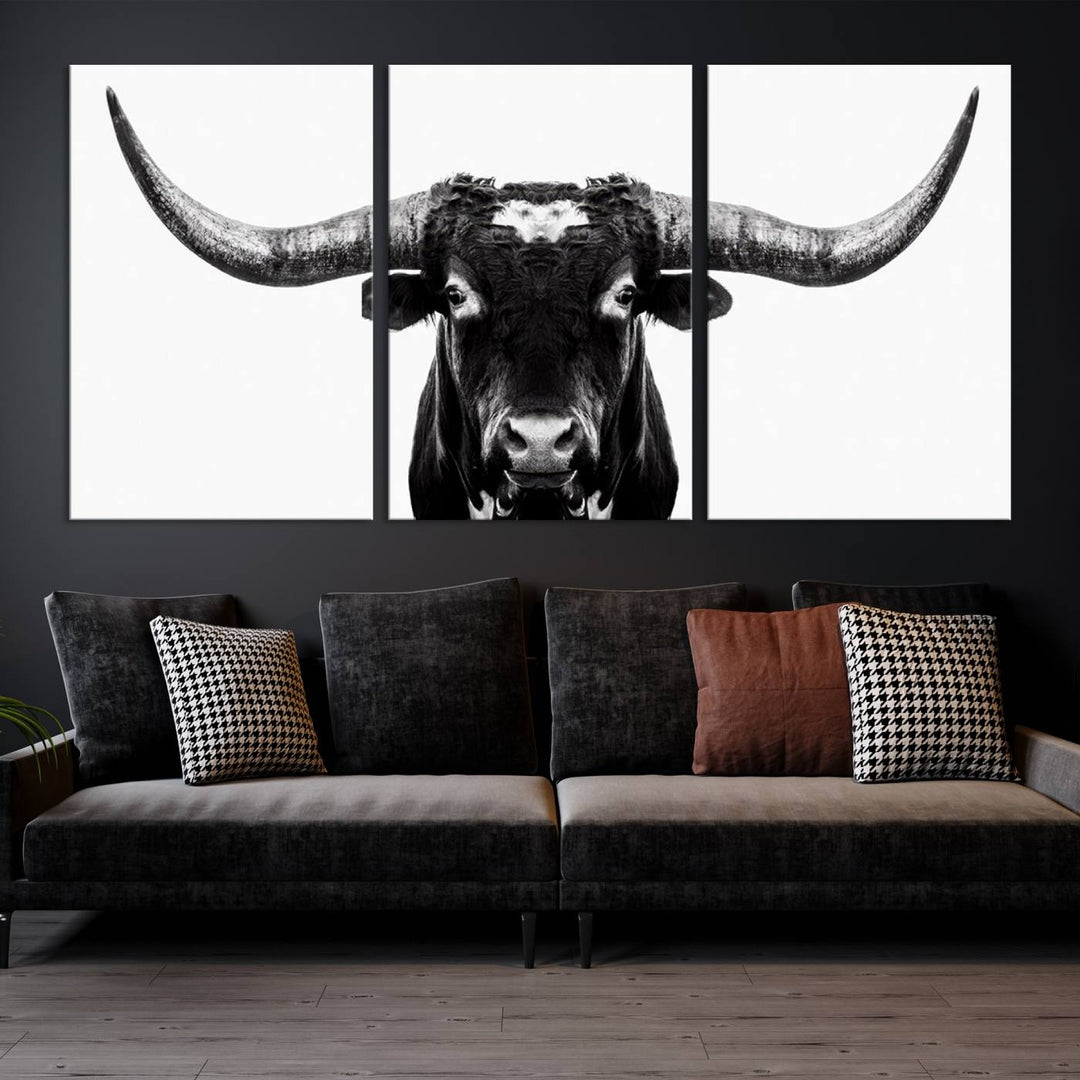 The living room is adorned with the Texas Cow Longhorn Wall Art Canvas Print in Black and White—framed and ready to hang.