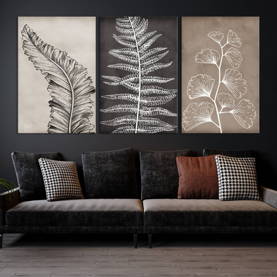 The Botanical Leaf Art Collection - 3-Panel Wall Art Canvas Print is framed above a modern console table.