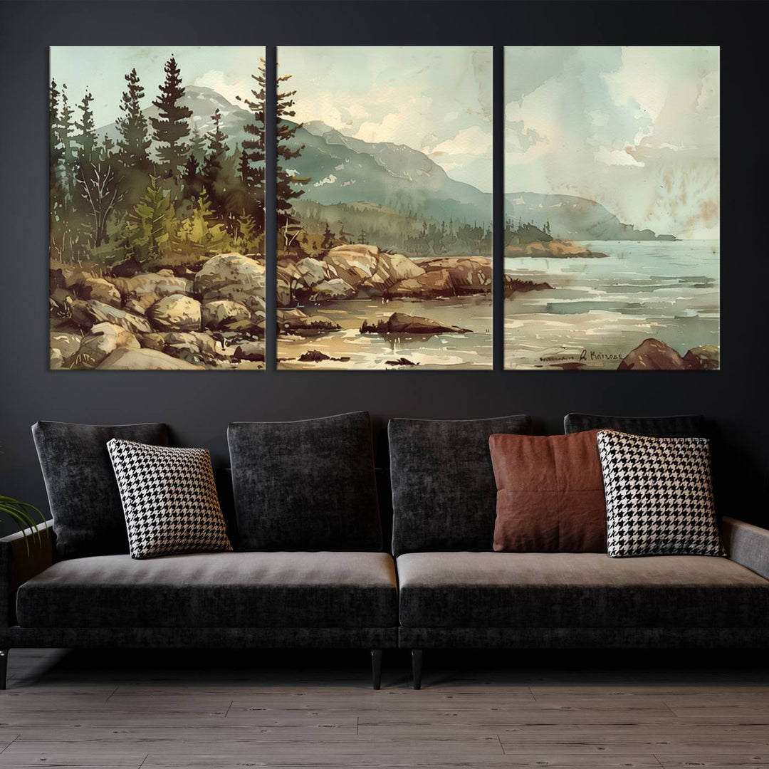 The living room features a breathtaking three-panel Abstract Acadia National Park Wall Art Canvas Print, which beautifully captures the rocky Maine coastline with trees and mountains.