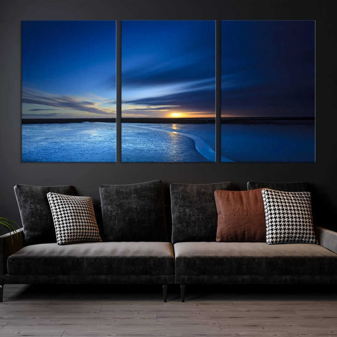 The living room features a triptych of the Wall Art Canvas Print Navy Sunset Lake Landscape Artwork, adding to its tranquil vibe.