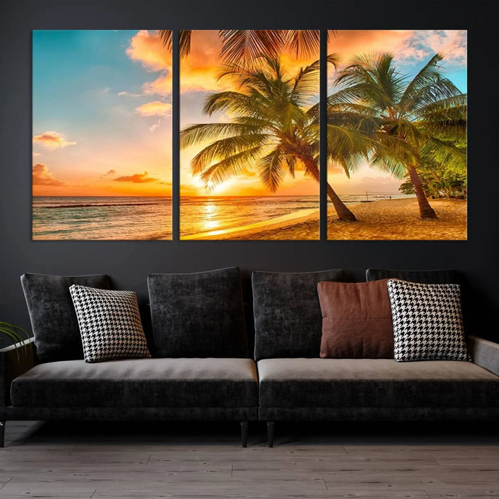 The Tropical Sunset Wall Art Print features a vibrant beach scene with palm trees and an ocean view highlighted by a golden sunset.