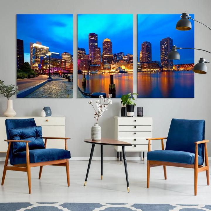 A triptych of the "Boston City Lights Night Blue Skyline Cityscape View Wall Art Canvas Print" adorns the wall. This museum-quality canvas artwork is ready to hang and includes a UV-protective coating for lasting brilliance.