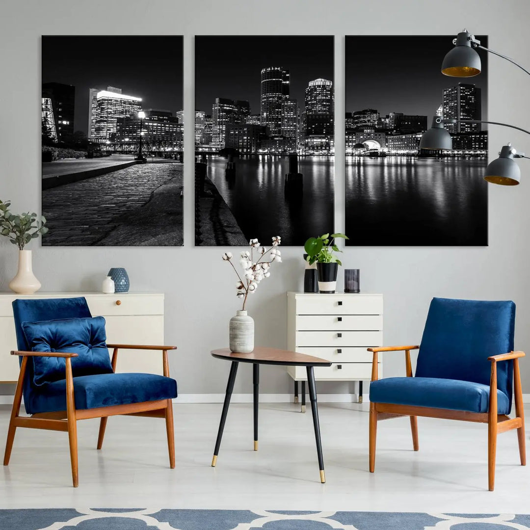 The Boston City Lights Skyline Black and White Wall Art Cityscape Canvas Print portrays a triptych of the city skyline at night reflecting on a calm river. This museum-quality canvas features UV-protective finishes to preserve its timeless allure.